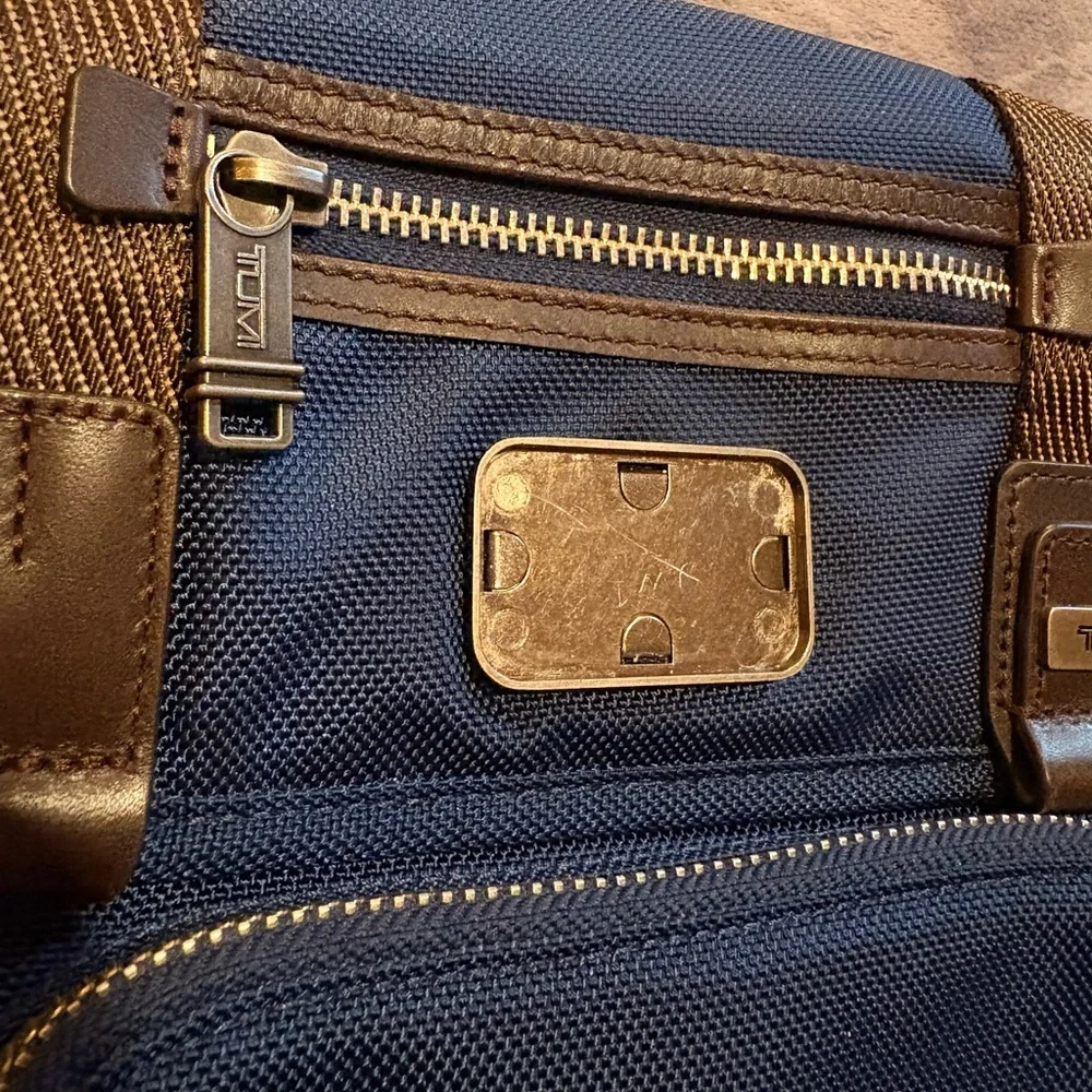Tumi Blue Messenger Bag with Brown Trim